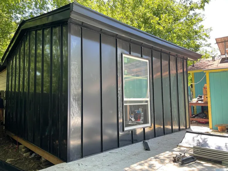 Black standing seam metal wall panels for Roof Inspection in Chaska