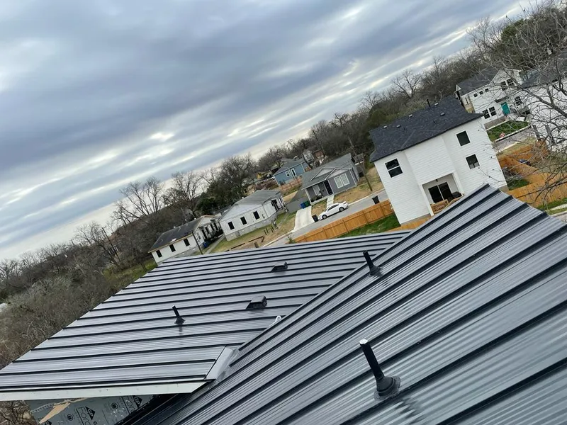 Standing seam metal roof panels with vents for Skylight Repair in Chaska